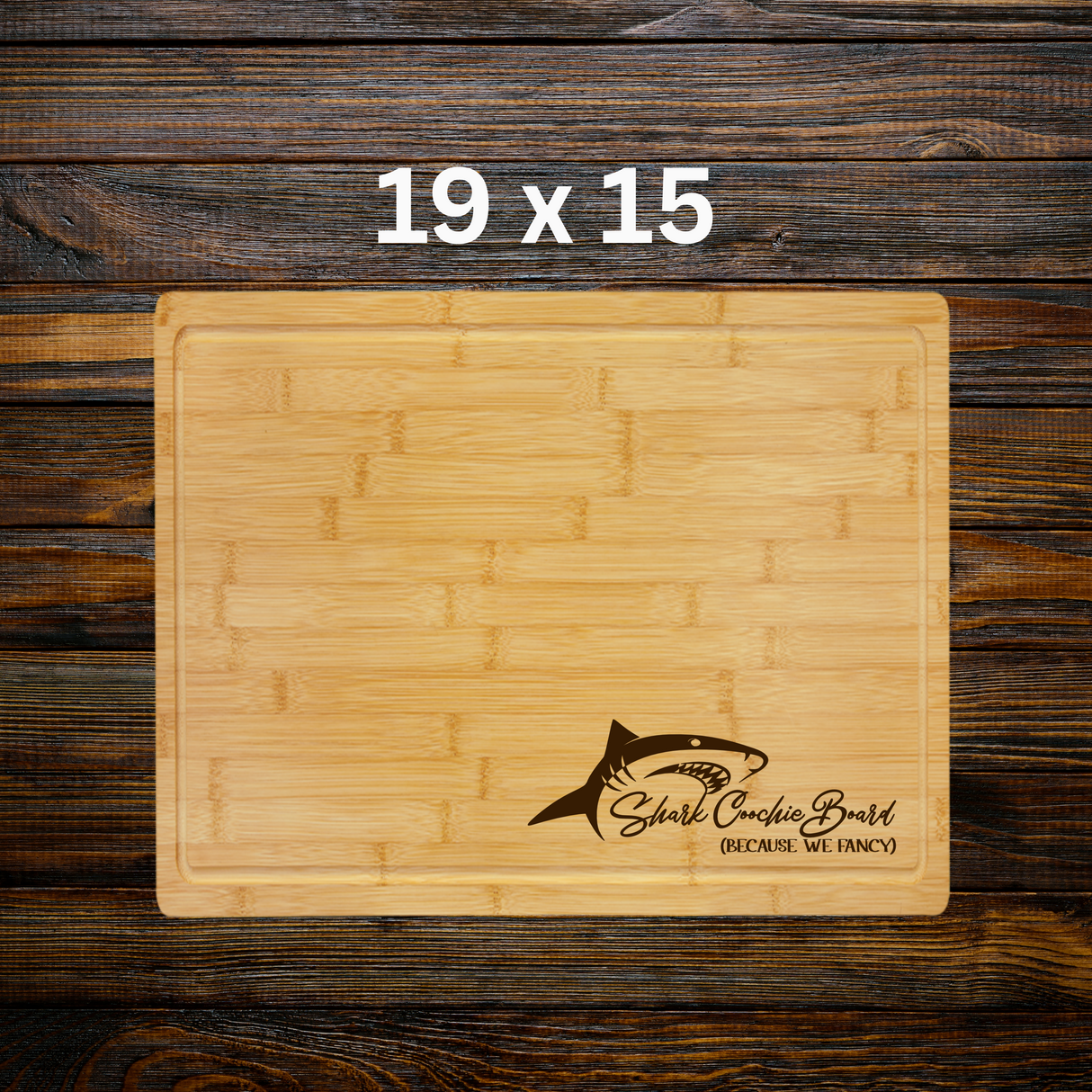 Wooden cutting board with shark logo and text on a wooden background