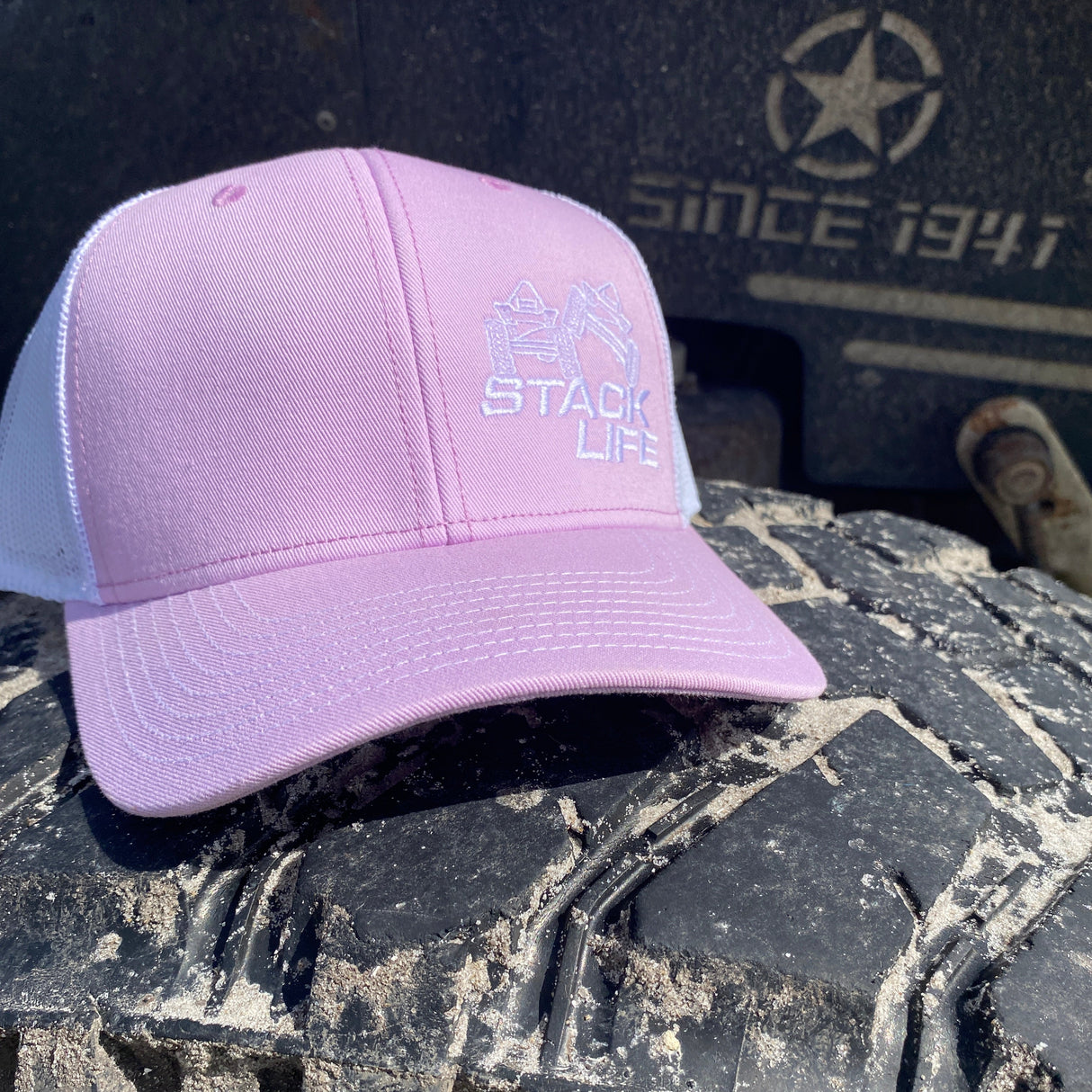 pink stack life trucker hat with whtie logo