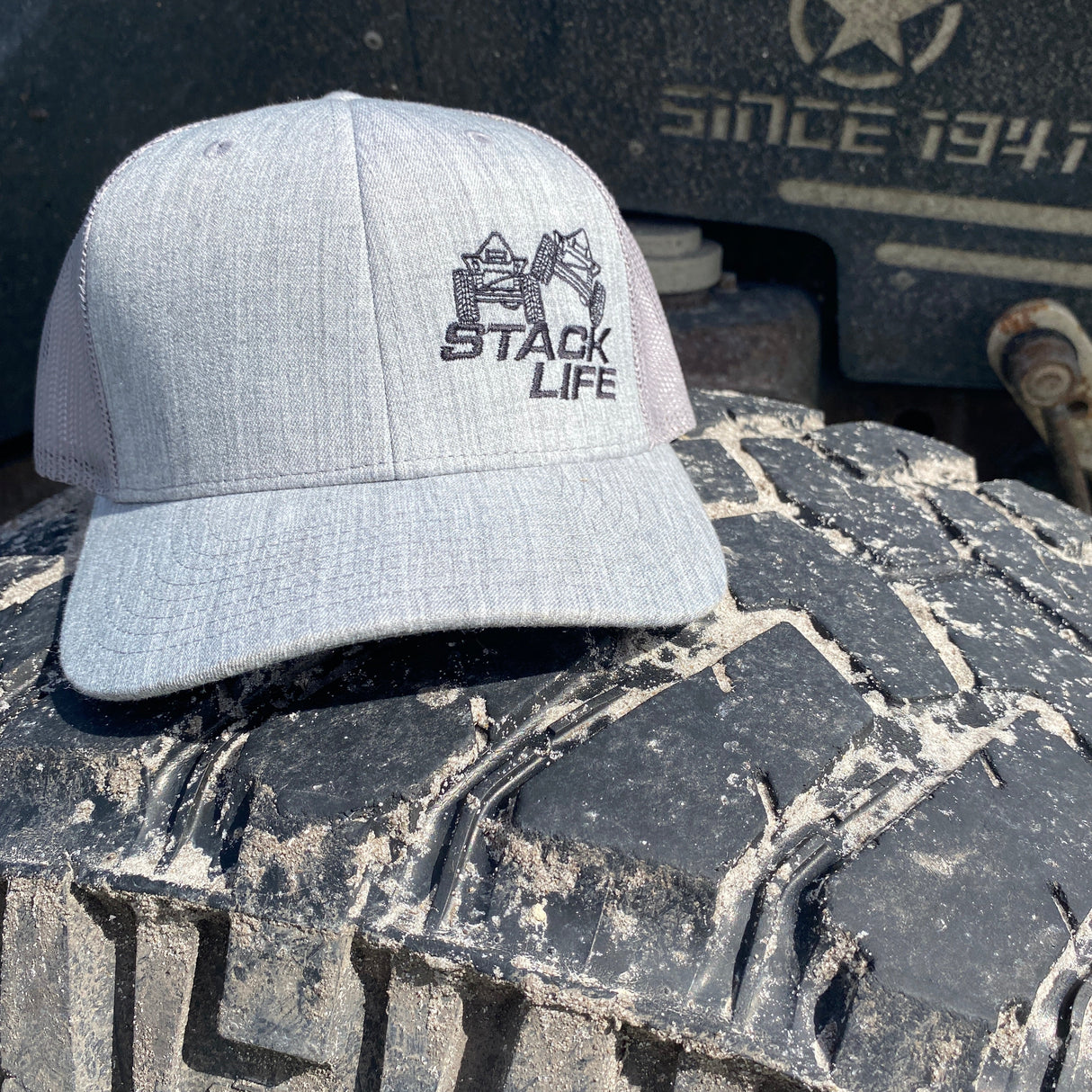 grey stack life trucker hat with black logo