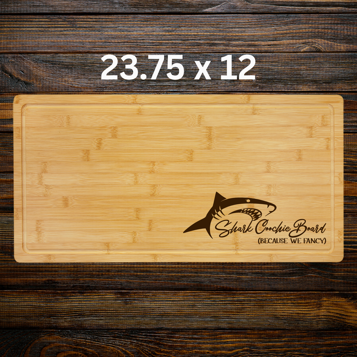 Wooden cutting board with shark design and text on a wooden background