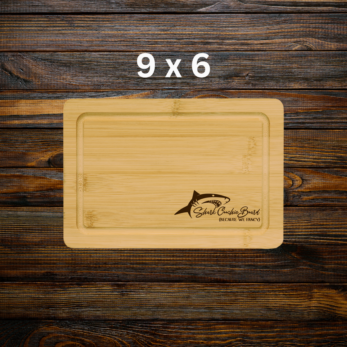 Wooden cutting board with shark logo on a wooden background