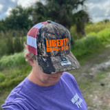 Liberty Runs Deep Trucker Hat |Camo Front with Flag Mesh Back