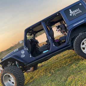 image of the mudhole mermaids back window logo on an off road vehicle
