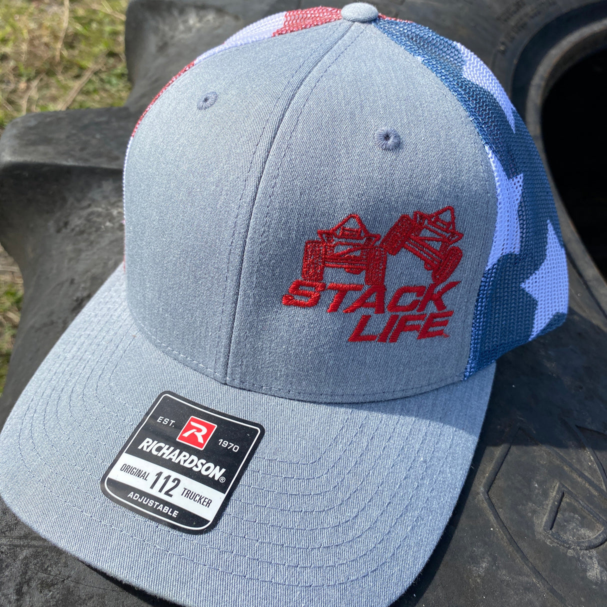 american flag trucker hat with grey front and red logo