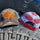 front back view of american flag camo trucker hat with oragne notsostock 4x4 on front