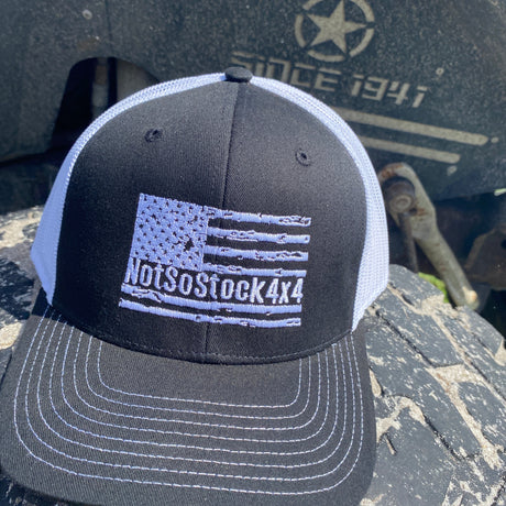 Black notSostock4x4 trucker hat with white american flag on front