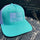 teal notsostock4x4 trucker hat with white american flag on front