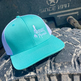 teal white trucker hat with mudhole mermaid logo