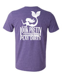 A purple t-shirt with a graphic print of a mermaid and text that reads 'Look Pretty, Play Dirty'
