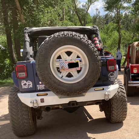 off road vehicle with stack life decal on the back tail lights area